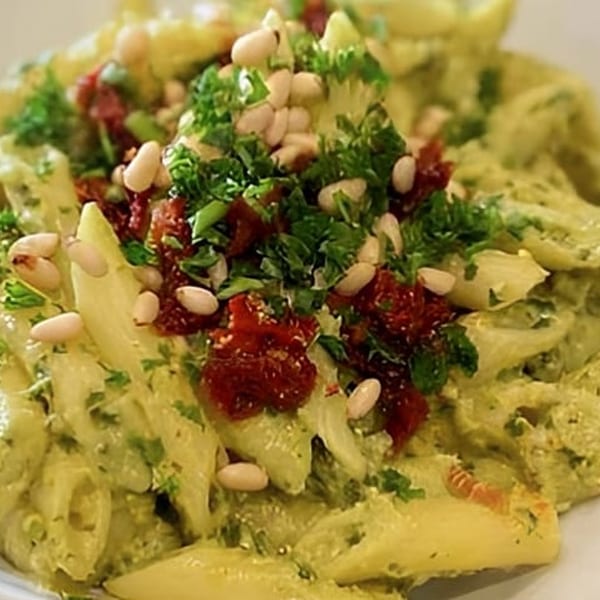 Ocado Restaurant's vegan pesto pasta with sun-dried tomatoes, pine nuts, and fresh parsley.